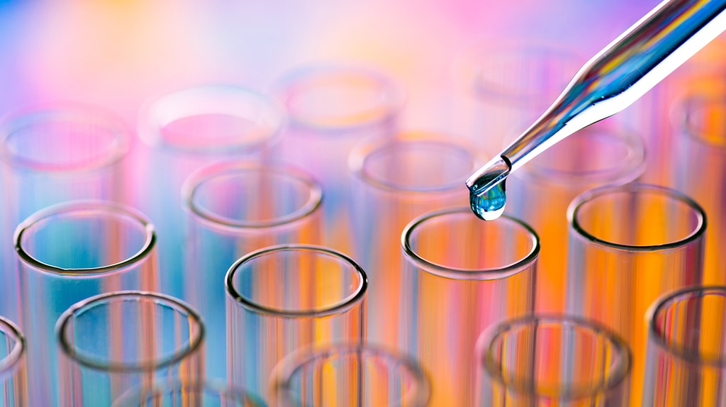 Close up of orange and blue science laboratory test tubes.