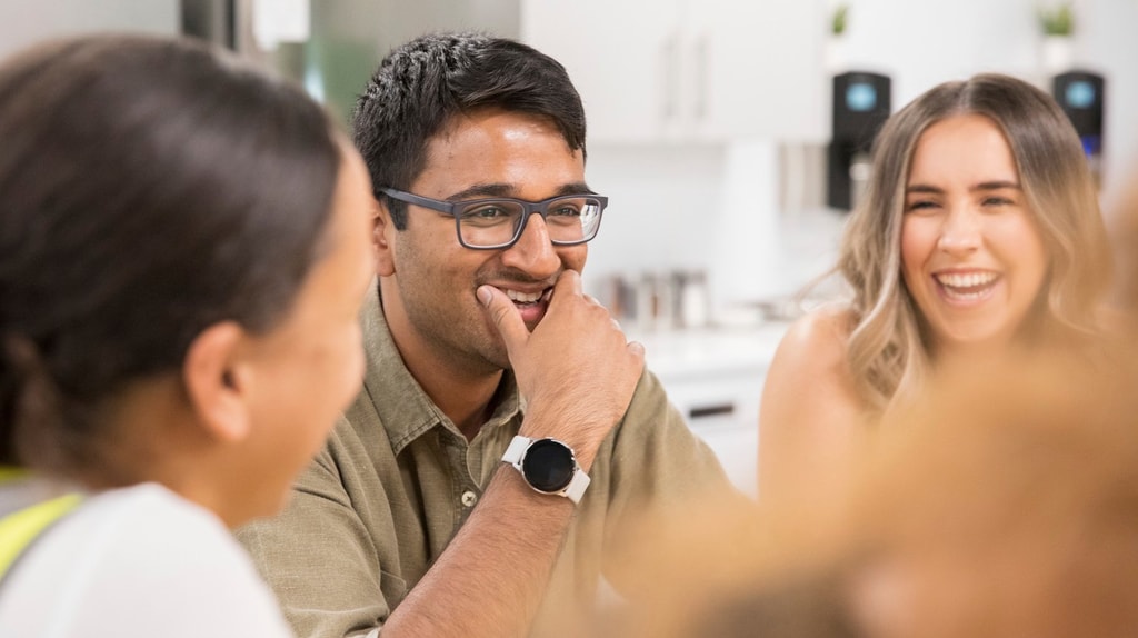 Mace colleagues smiling during a conversation