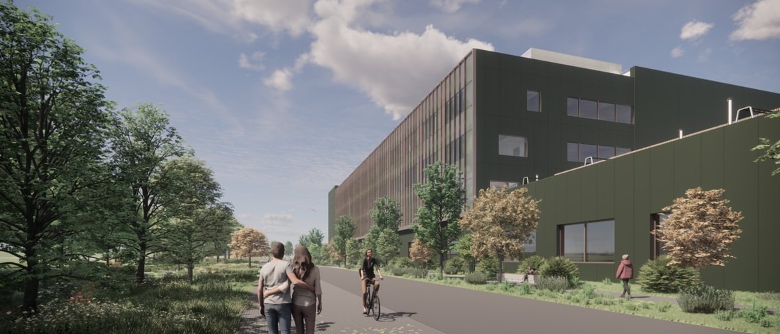 Exterior view of the Natural History Museum project showing a modern green building surrounded by trees, with people walking and cycling along a landscaped pathway.