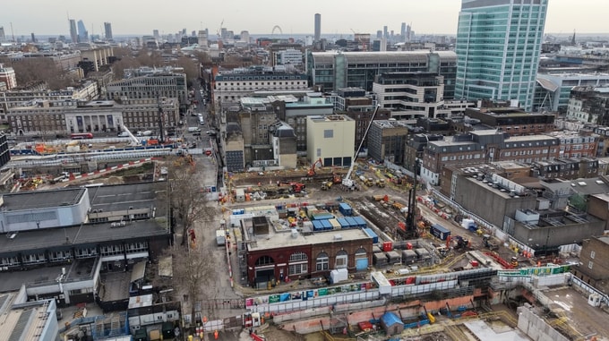 Aerial view of the HS2 Euston construction site showing multiple work areas, temporary buildings, cranes, and construction activity within a dense urban setting.