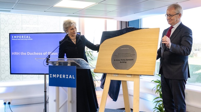 Plaque unveiling ceremony at the Imperial National Heart and Lung Institute, showing a lectern with Imperial branding and a commemorative plaque on display.
