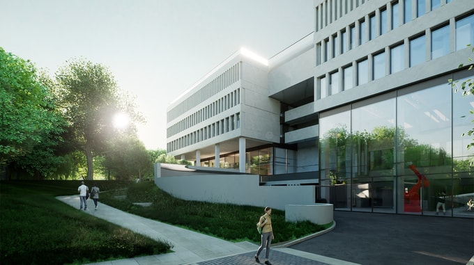 Modern building with large glass windows, surrounded by greenery, as people walk along a pathway in the serene morning light.