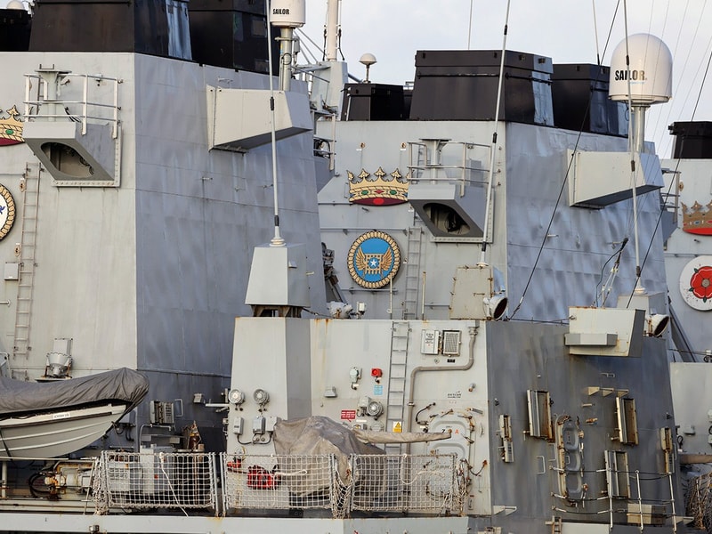 A large ship with a lot of windows on it's side