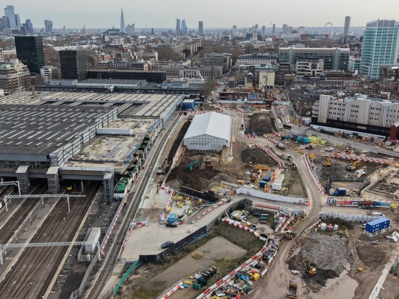Aerial view of the HS2 Euston construction site showing rail infrastructure, active work zones, temporary roads, and surrounding urban development.