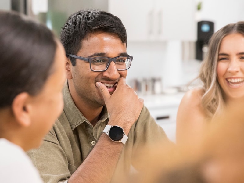 Mace colleagues smiling during a conversation